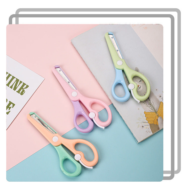 Kids safety scissors by IBG in macaron colors, designed for safe paper cutting for children and school use.