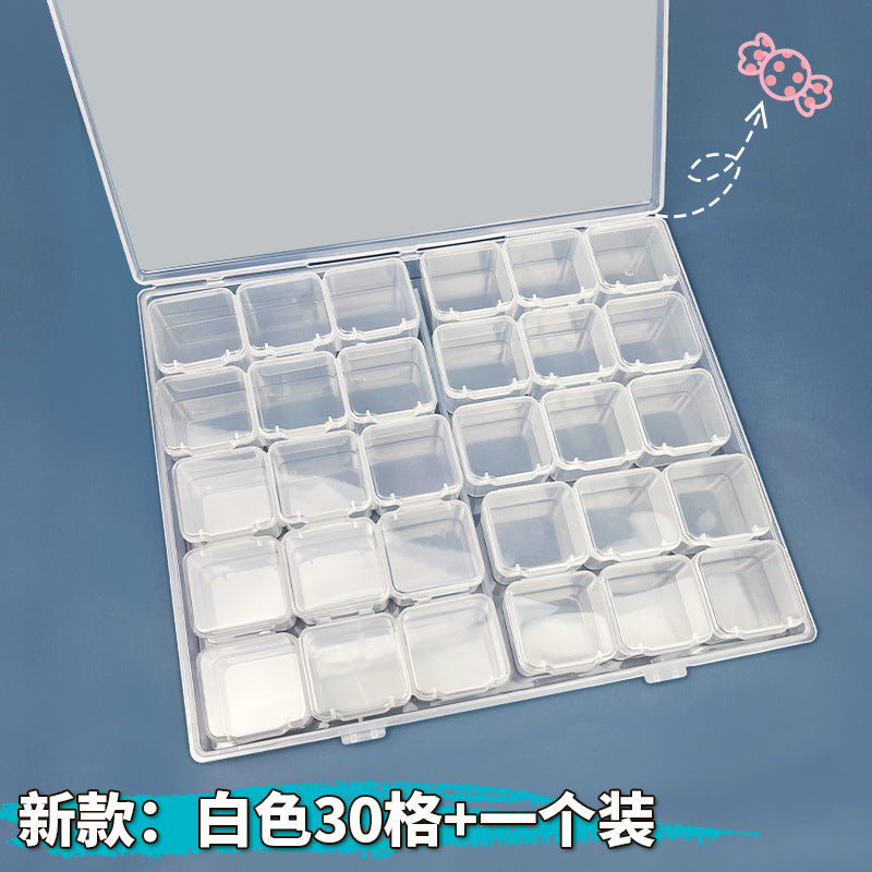 Clear IBG transparent jewelry storage box with multiple compartments for organizing rings, necklaces, and bracelets.