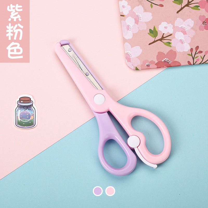 Kids safety scissors in pastel macaron colors, designed for children and school use, with child-friendly, rounded tips.