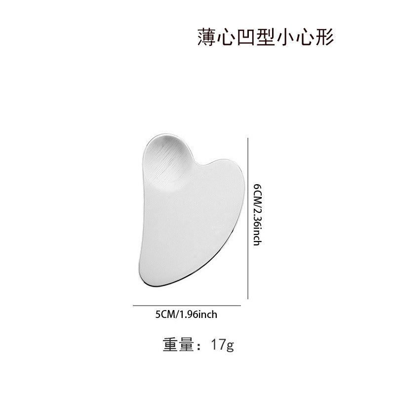 IBG stainless steel Gua Sha massage tool for facial and body skincare, smooth and sleek with polished surface and ergonomic design.