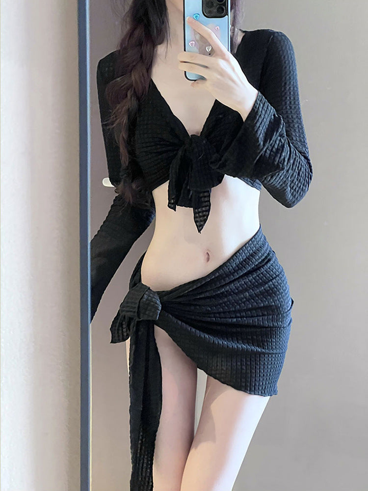 Women's IBG long sleeve swimsuit set with four pieces, featuring a stylish swimwear design and full coverage for swimming.