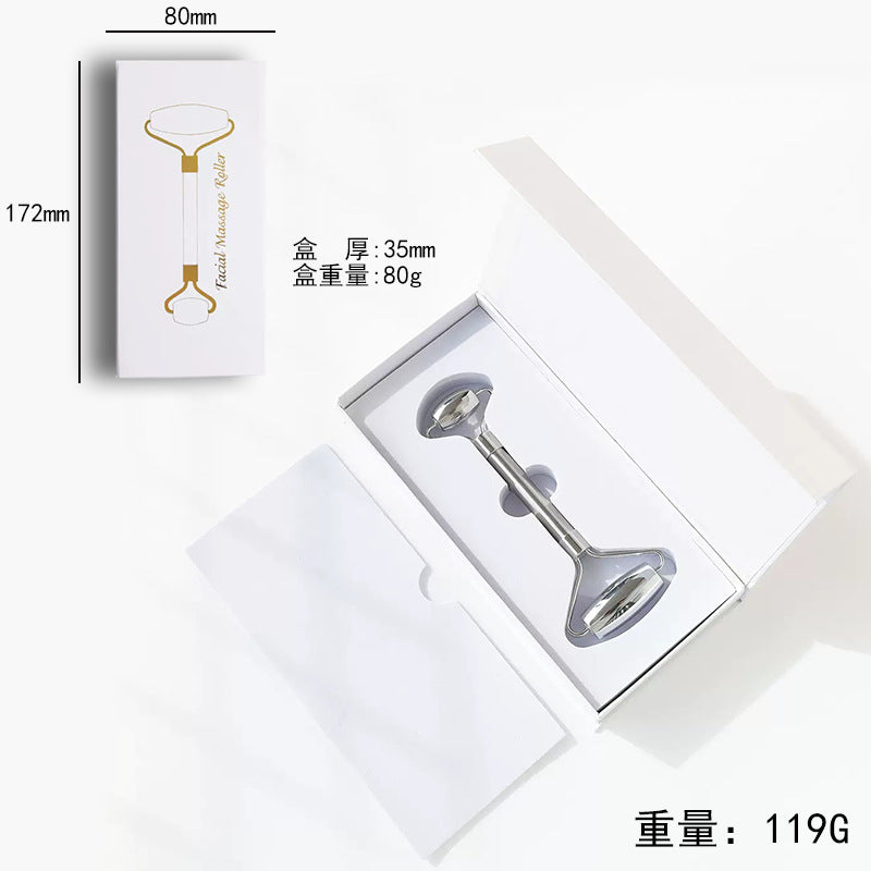 IBG stainless steel Gua Sha massage tool for facial and body skincare, with smooth, polished surface and ergonomic shape.