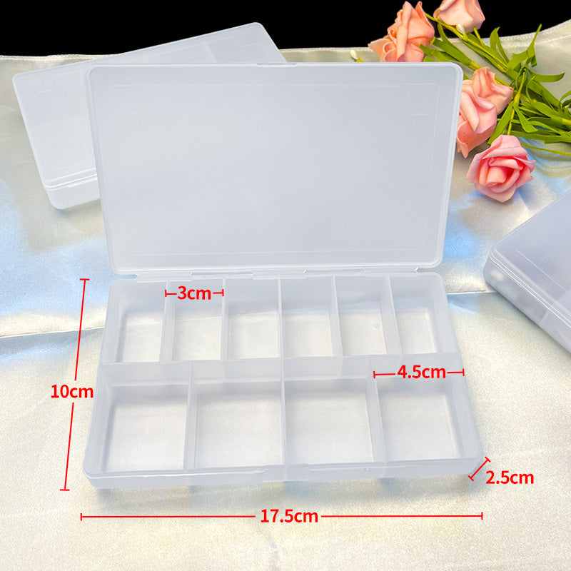 Clear jewelry storage box with multiple compartments by IBG, designed for organizing rings, necklaces, and small accessories.
