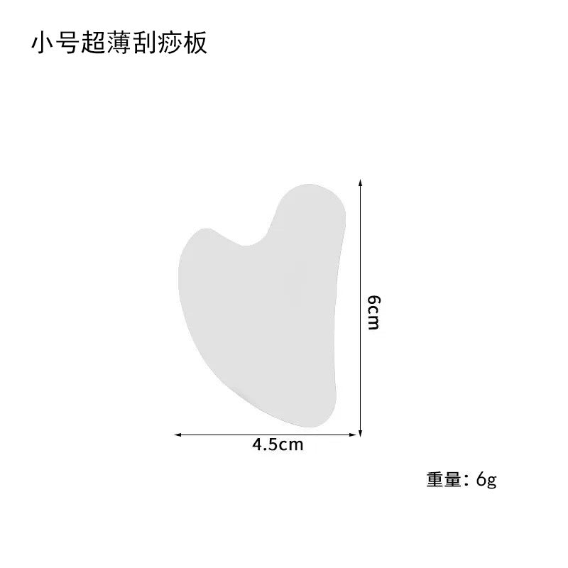 IBG stainless steel Gua Sha massage tool for facial and body skincare, with smooth, polished surface for gentle massage.