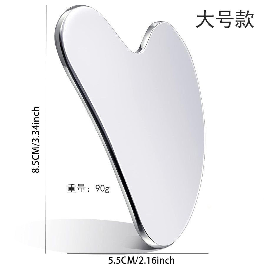 IBG stainless steel Gua Sha massage tool for facial and neck skincare in a beauty and personal care setting.