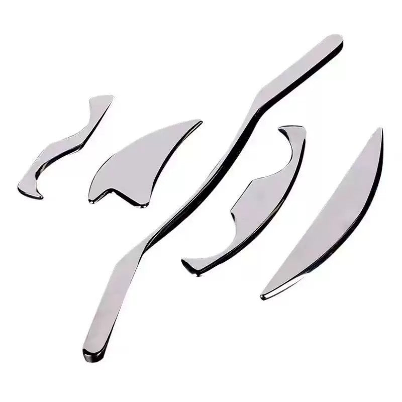 IBG stainless steel Gua Sha massage tool for facial and body skincare, featuring smooth, curved edges for gentle skin massage.