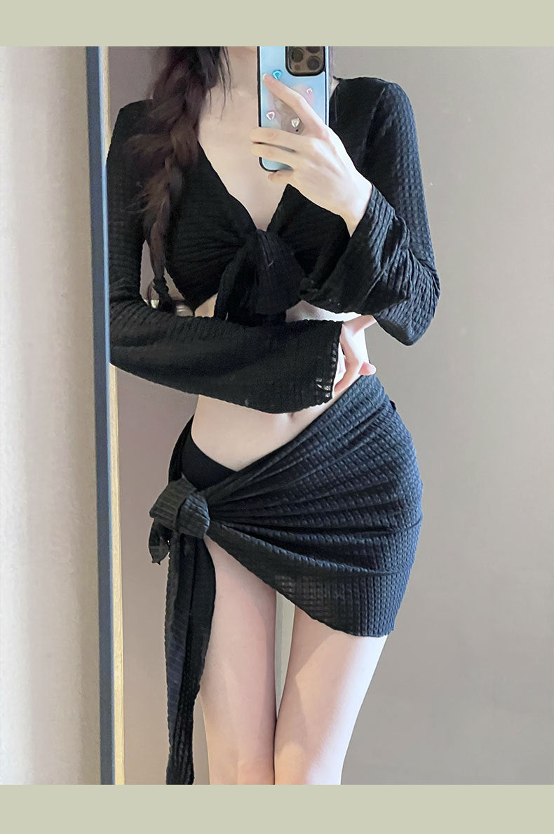 Women's IBG 4-piece long sleeve swimsuit set featuring a stylish swimwear design with long sleeves and matching pieces.