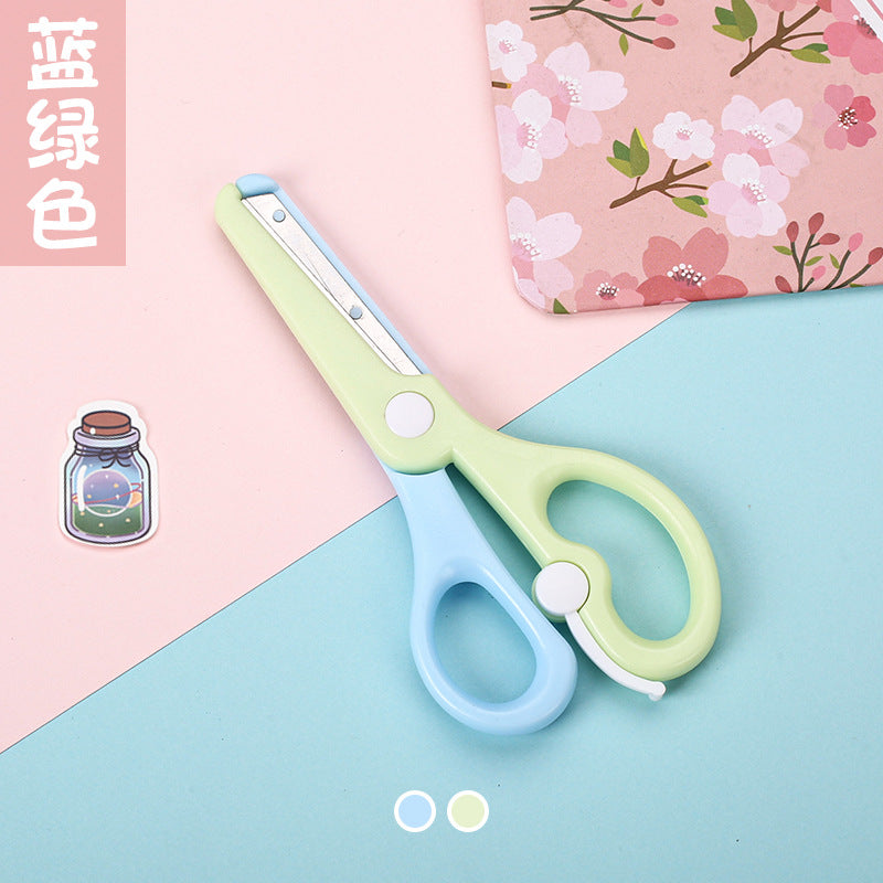 Kids safety scissors in macaron colors by IBG, featuring rounded tips and colorful handles for safe use by children.