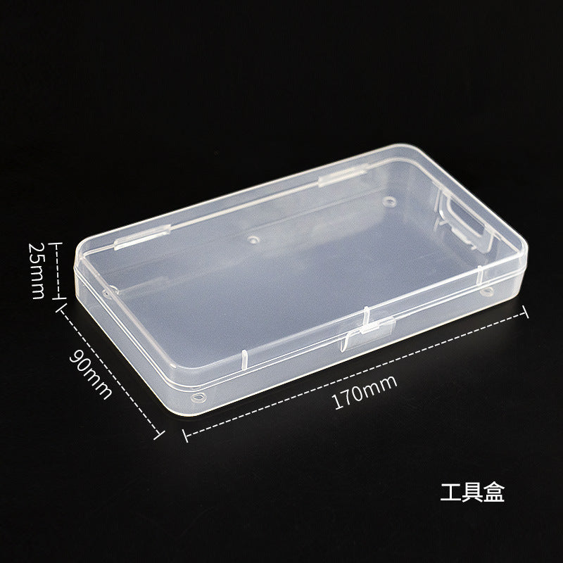 Transparent IBG jewelry storage box with multiple compartments for organizing rings, necklaces, and earrings.