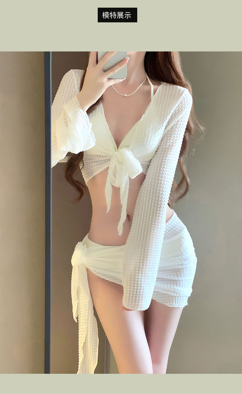 Women's IBG 4-piece long sleeve swimsuit set with top, bottoms, and cover-up, featuring stylish swimwear design and vibrant colors.