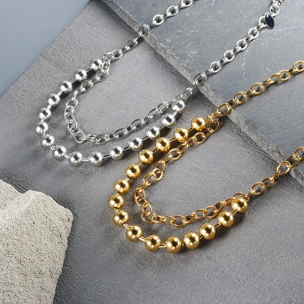 Stainless steel ball chain necklace by IBG, minimal everyday jewelry with small round beads on a sleek chain.