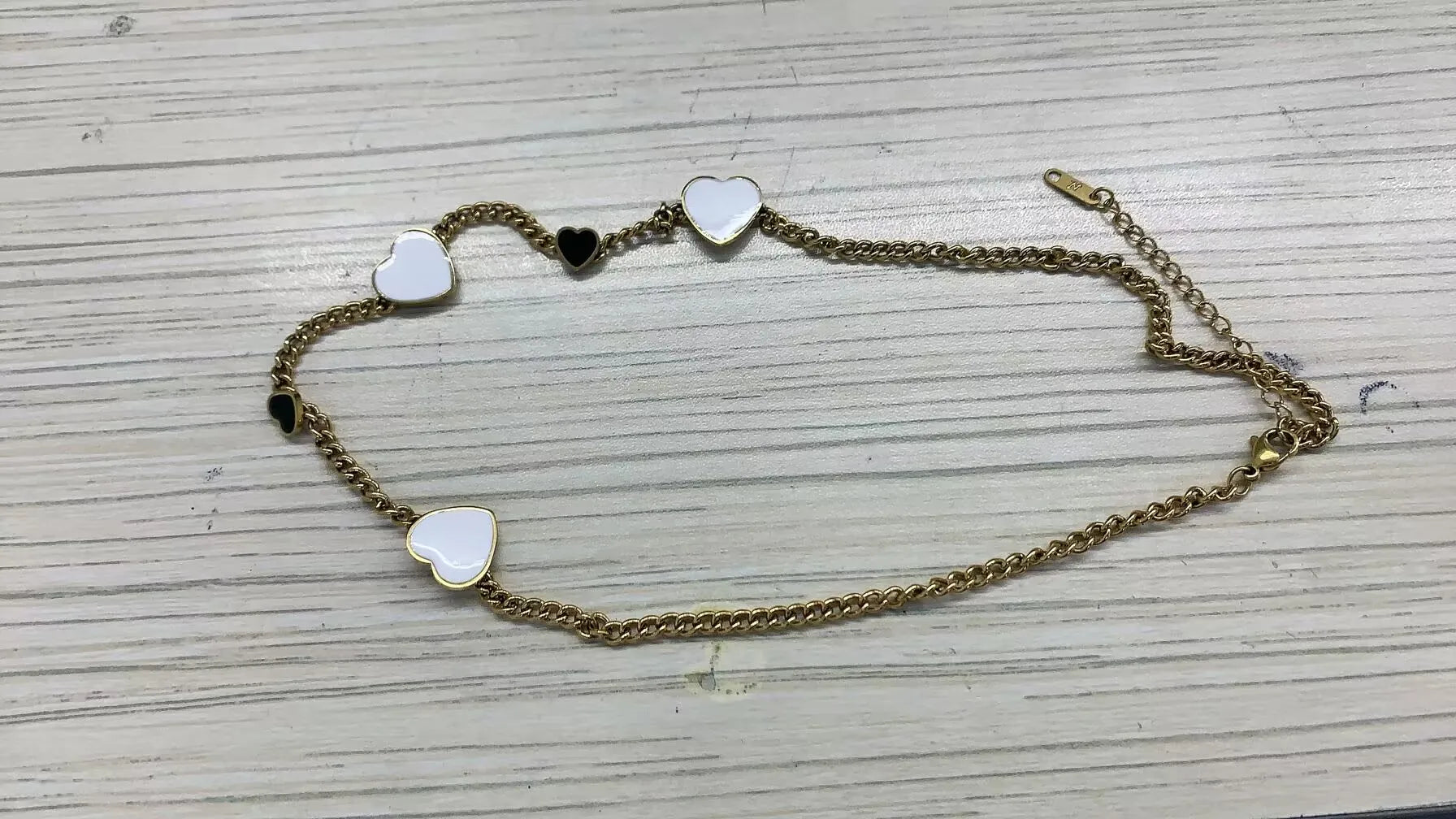 Stainless steel ball chain necklace by IBG, minimal everyday jewelry with smooth round beads on a silver chain.